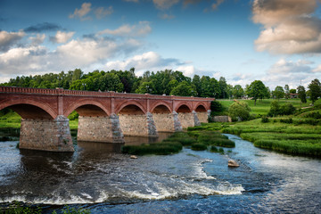 Fototapeta premium Old bridge with arches over the river.
