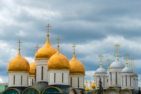 Domes of churches of the Moscow Kremlin on a background of a stormy sky