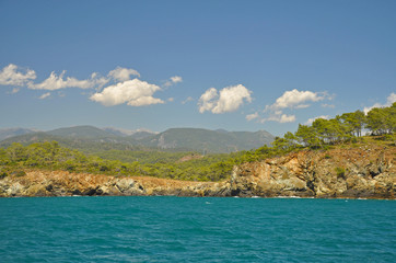 Naklejka premium Seascape with azure sea and mountains