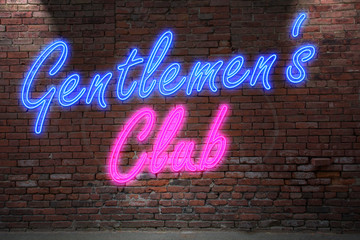 Leuchtreklame Gentlemen’s Club an Ziegelsteinmauer