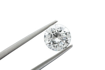 loose brilliant diamond is being held by a tweezers on white background