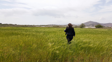 Woman walking through a field