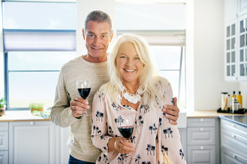 Cute middle aged couple with wine