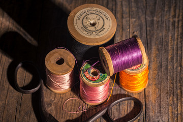 Still life of original old wooden scarce spools from Slovak thread manufacture 