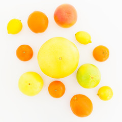 Fresh lemon, orange, mandarin, grapefruit, sweetie and big pomelo fruits on white background. Flat lay, top view.
