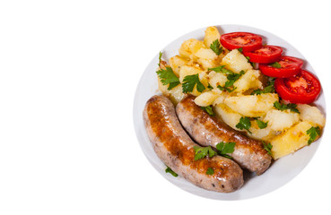 Potatoes with sausages on plate. top view. isolated on white