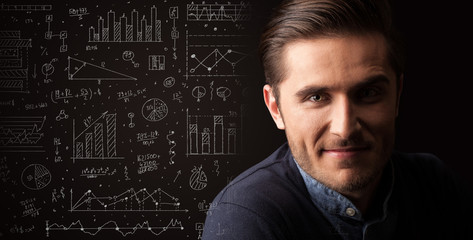 Portrait of a young businessman on dark background