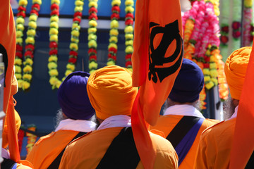 men in orange dress during a sikh event