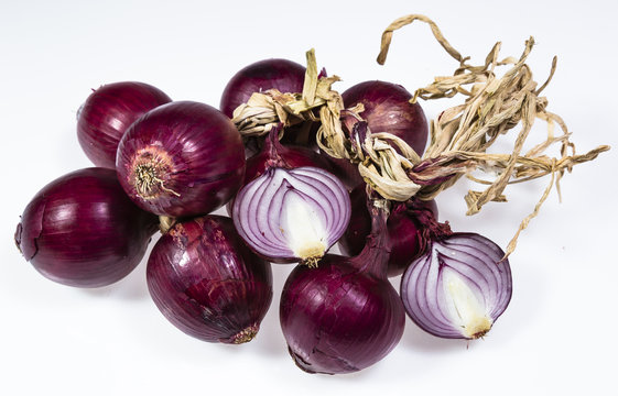 Fresh red sliced onion and bulbs background
