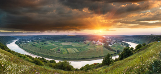 Panoramic view from the hill on  bend of the river at sunset. Dniester Canyon. Ukraine.
