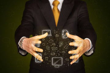 Businessman holding networking icons