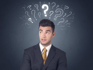 Businessman with question marks