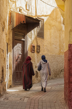 MEKNES, MOROCCO - FEBRUARY 18, 2017: Unidentified women walking in the street of Meknes, Morocco. Meknes is one of the four Imperial cities of Morocco.
