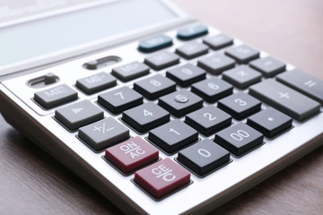 Calculator on table, closeup