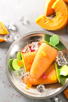 Homemade orange ice cream on a stick