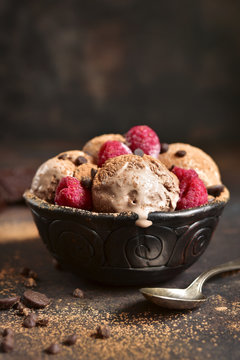 Homemade chocolate ice cream with raspberry and chocolate chips.
