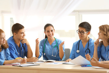 Fototapeta premium Group of medical students having lecture indoors