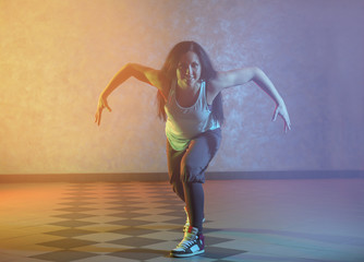 Beautiful young hip-hop dancer in studio