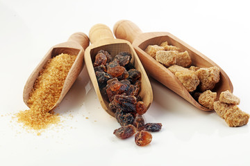 Composition with brown sugar on white background