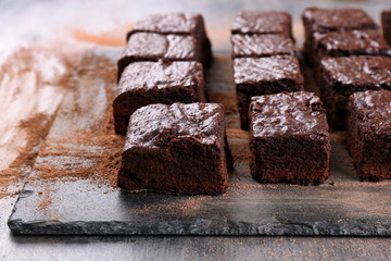 Slate plate with pieces of delicious chocolate brownie