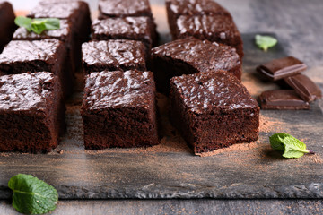 Slate plate with pieces of delicious chocolate brownie