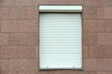 Plastic window with roller shutters
