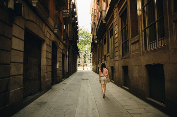 Young woman walking on Barcelona streets