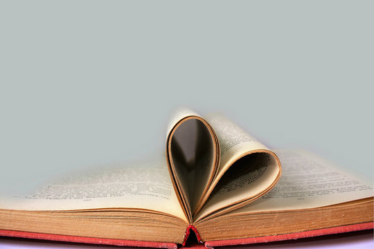 Heart symbol from book pages with empty space for text