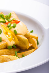 Chips with cheese sauce.