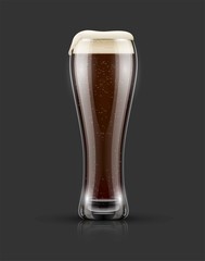 Full glass of black craft beer with froth on top. Isolated dark