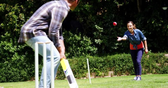 Couple Playing Cricket