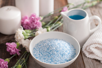 Beautiful spa composition with spring flowers and sea salt.