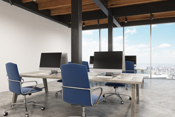Office with metal pillars, two computers