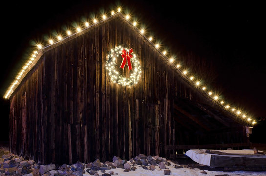Lighted Christmas Wreath on Old Barn