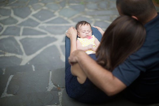 newborn fusses in mothers lap