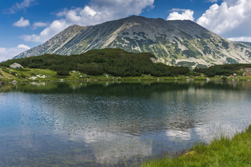 Panorama with Todorka Peak and reflection in Muratovo lake, Pirin Mountain, Bulgaria