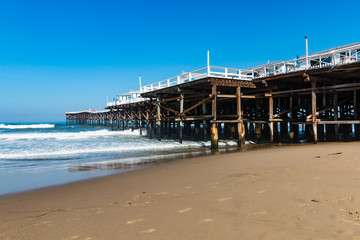 Hotel cottages atop the Pacific Beach fishing pier in San Diego, California.  