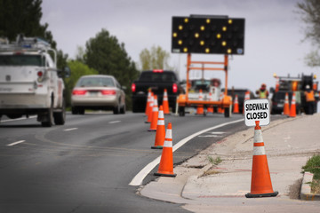 Lane shifter lights with traffic and sidewalk closed sign for construction