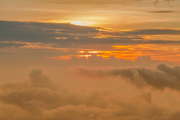 Fototapeta premium Shot from an airplane. Evening sunset. Background of clouds, sun