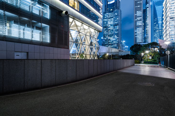 empty space front of modern business architecture at night in city of China.