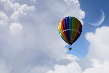 Aerostat flying above clouds . Mixed media