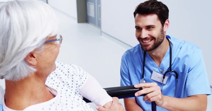 Nurse having a conversation with female senior patient