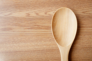 blank wooden spoon on table background