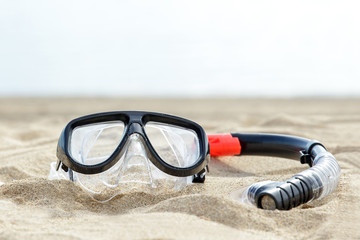 mask and snorkel on the sand