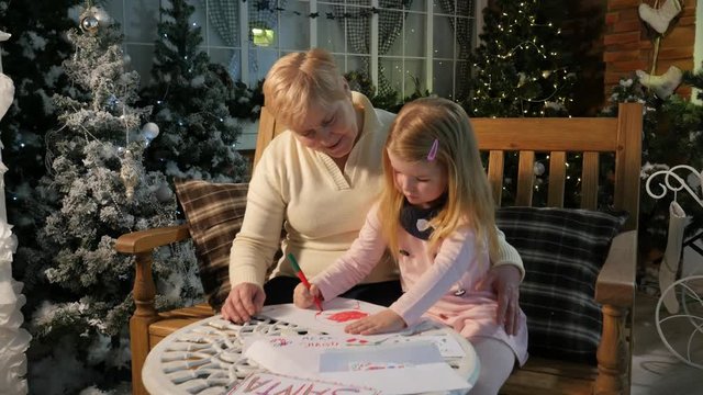 Childhood Memories Grandma and Little Girl Drawing Together at Home New Year Celebration Lights Are Sparkilng in Cosy Room Family Holiday Time Flies Fast
