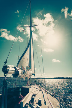 Yachting on sail boat during sunny weather