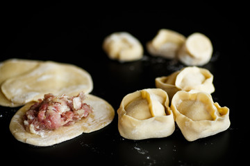 traditional raw manti with meat inside