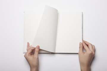 woman hand hold a book(note) isolated white.