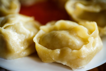 Traditional boiled manti in a plate