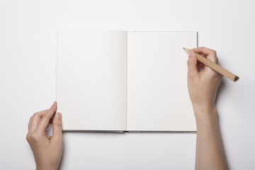 woman hand hold a book(note) isolated white.